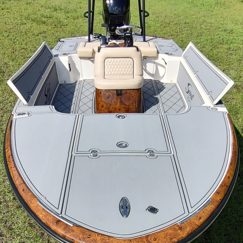 White center console boat with faux wood trim