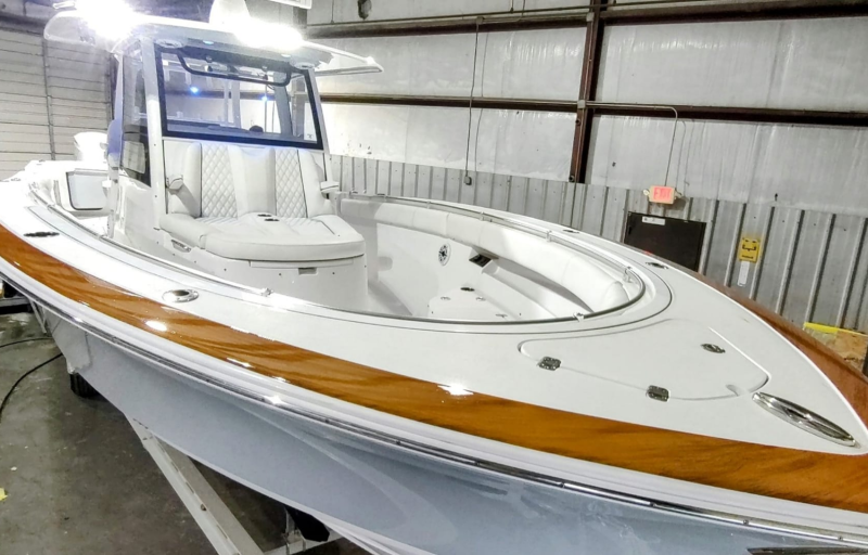 White center console boat with faux wood trim