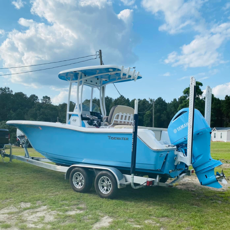 Blue center console boat with matching outboard motor